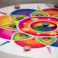 Brightly coloured rangoli-style artwork.