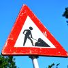 Roadworks sign - a red triangle around a person digging.