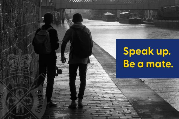 two teenage boys walking alongside a canal with words Speak Up Be A Mate